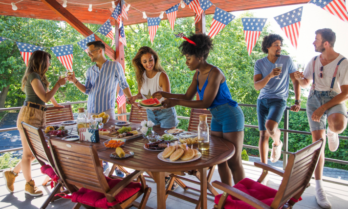 A group of people having fun at an outdoor Fourth of July party.