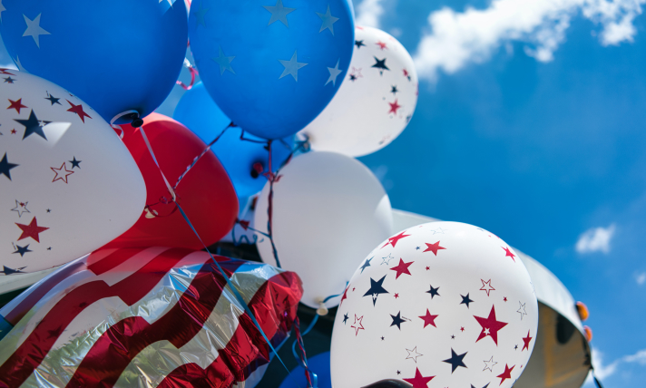 Close-up of red, white, and blue balloons.