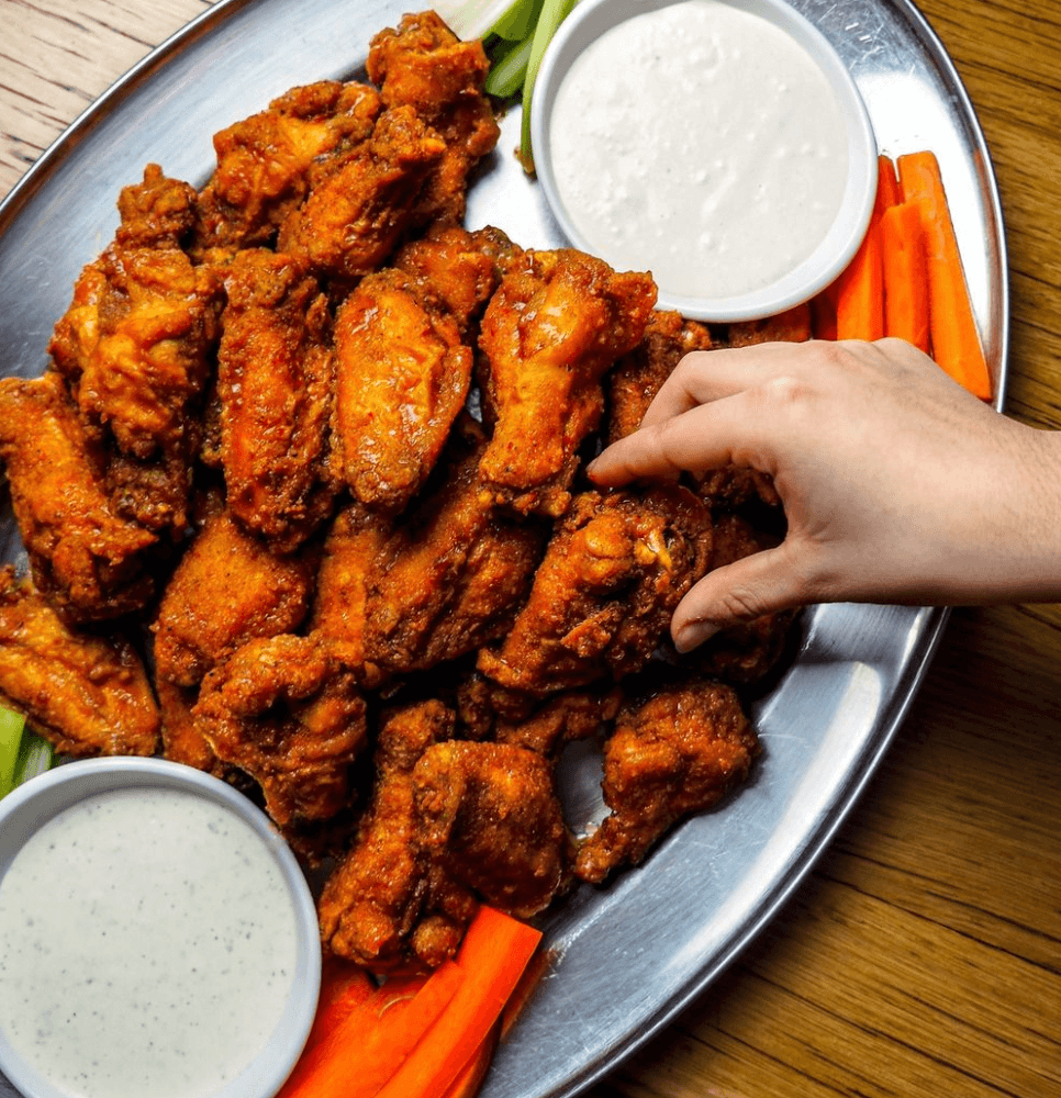 A plate of wings and ranch at the Fifty/50