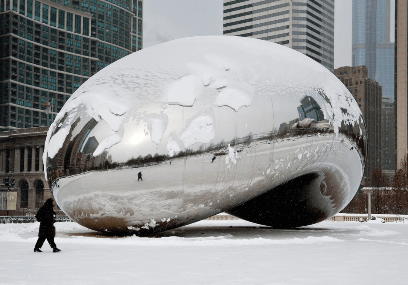 The Chicago "bean" in winter with snow.