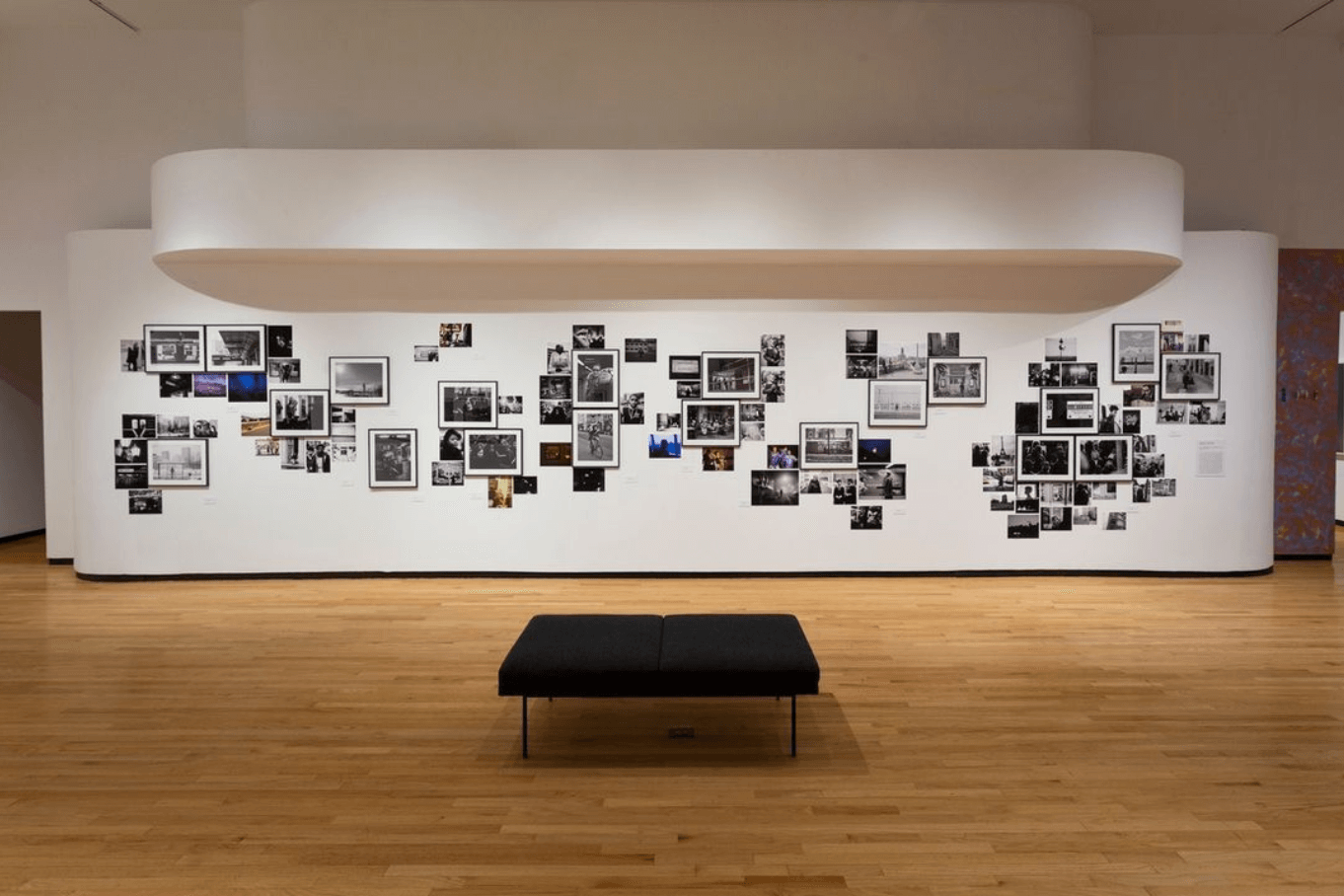 A display of black and white photos and a bench at The Museum of Contemporary Photography in Chicago.